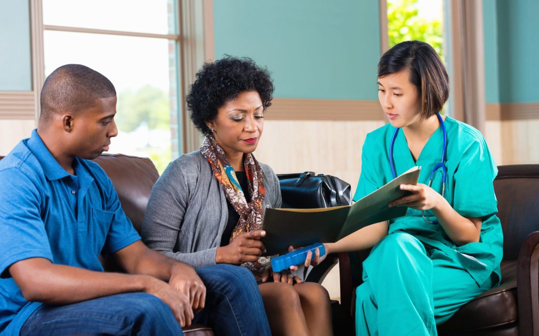 Home healthcare nurse talking to patient