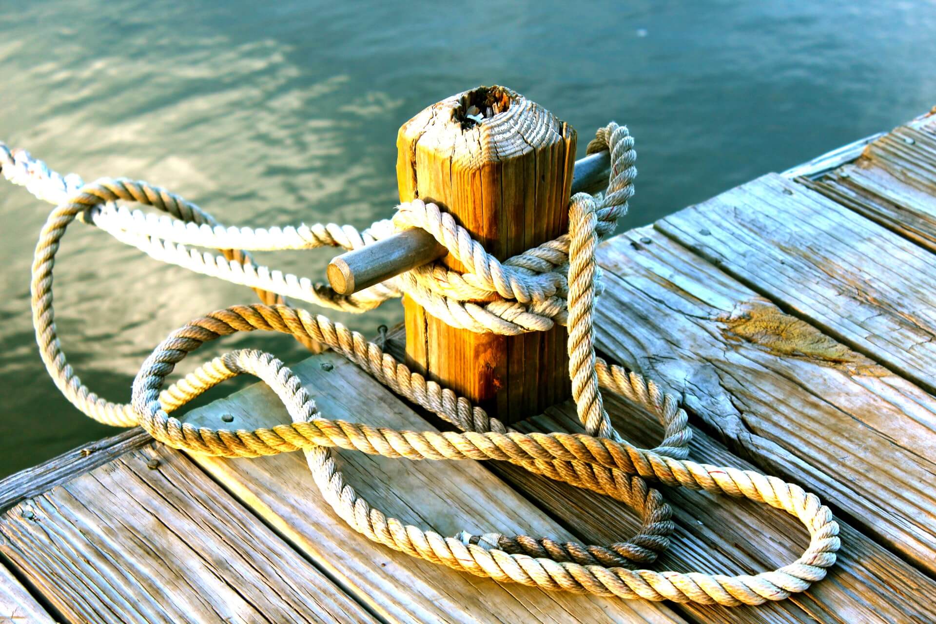 Rope being used to tie up a boat on a dock